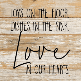 Toys on the floor, dishes in the si...