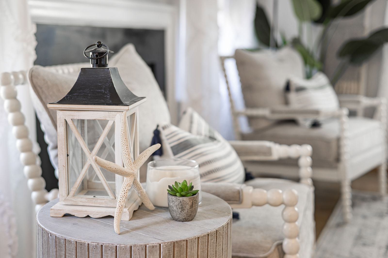 Coastal style living room with ocean view, blue accents and breezy whites