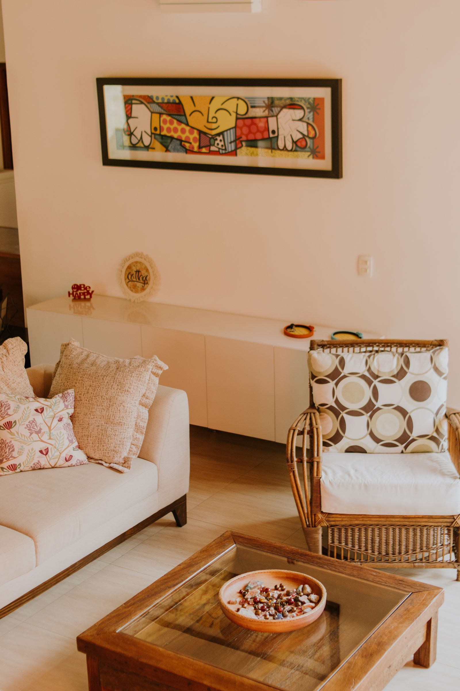 Modern style living room with clean lines, dark accent wall and neutral tones